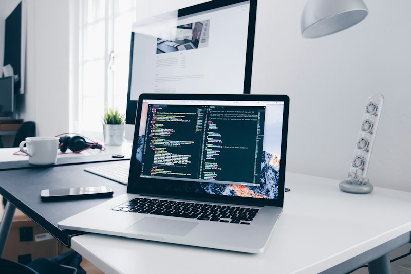 Laptop showing code on a desk